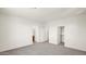 Neutral bedroom featuring gray carpet, walk-in closet, and ensuite bathroom at 16010 N 74Th Ln, Peoria, AZ 85382