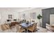Dining area with a modern table and chairs, open to the kitchen and living room at 16010 N 74Th Ln, Peoria, AZ 85382