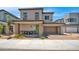 Charming two-story home featuring a two-car garage, covered porch, and exterior seating at 16010 N 74Th Ln, Peoria, AZ 85382