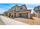 Charming two-story home featuring a two car garage, covered front porch, and well-manicured landscaping at 16010 N 74Th Ln, Peoria, AZ 85382