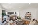 Open-concept living room and kitchen area with modern finishes and ample natural light at 16010 N 74Th Ln, Peoria, AZ 85382