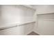 Spacious walk-in closet with built-in shelving and rods for ample storage at 16010 N 74Th Ln, Peoria, AZ 85382