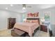 Inviting main bedroom with a comfortable bed, matching nightstands, and plenty of natural light at 17890 N 99Th Dr, Sun City, AZ 85373