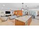 Open floor plan showcasing the kitchen island with a marble countertop and adjacent living areas at 17890 N 99Th Dr, Sun City, AZ 85373