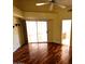 Vaulted bedroom offers hardwood floors, sliding glass doors and bathroom access at 1836 N Stapley Dr # 88, Mesa, AZ 85203