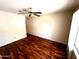 Cozy bedroom with hardwood floors, neutral walls, and a ceiling fan at 1836 N Stapley Dr # 88, Mesa, AZ 85203