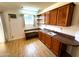 Bonus room with wood floors, built-in cabinets and sink, and bright window at 1836 N Stapley Dr # 88, Mesa, AZ 85203