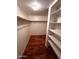 Walk-in closet with rod and shelves for storage at 1836 N Stapley Dr # 88, Mesa, AZ 85203