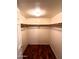 Walk-in closet with hardwood floors and wood closet rods at 1836 N Stapley Dr # 88, Mesa, AZ 85203