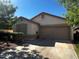 Inviting single-story home featuring a neutral color palette, a two-car garage and a well-maintained front yard at 1836 N Stapley Dr # 88, Mesa, AZ 85203