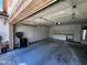 Spacious two-car garage with storage cabinets and work bench at 1836 N Stapley Dr # 88, Mesa, AZ 85203
