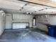 Spacious two-car garage with storage cabinets and work bench at 1836 N Stapley Dr # 88, Mesa, AZ 85203