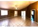 Spacious living room offers tiled floors, neutral walls, and access to other areas of the home at 1836 N Stapley Dr # 88, Mesa, AZ 85203