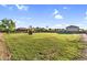 Expansive backyard with lush lawn and mountain views offers ample space for outdoor activities at 18822 E Flintlock Dr, Queen Creek, AZ 85142