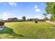 Expansive backyard with lush lawn, perfect for outdoor activities and relaxation, offering privacy and space at 18822 E Flintlock Dr, Queen Creek, AZ 85142
