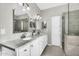 Bathroom features double sinks, stone countertops, and glass-enclosed shower at 18822 E Flintlock Dr, Queen Creek, AZ 85142