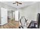 Office with wood flooring, neutral walls, white trim, and an open doorway into the next room at 18822 E Flintlock Dr, Queen Creek, AZ 85142