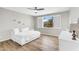Bright bedroom with white daybed and a view of the neighborhood at 18822 E Flintlock Dr, Queen Creek, AZ 85142