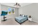 Relaxing bedroom with shutters for natural light, with a TV and minimalist decor at 18822 E Flintlock Dr, Queen Creek, AZ 85142