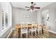 Neutral dining room with a wood table and white chairs at 18822 E Flintlock Dr, Queen Creek, AZ 85142