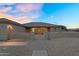Charming home with desert landscaping and a brick walkway leading to the front entrance at 18822 E Flintlock Dr, Queen Creek, AZ 85142