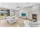 Bright living room with vaulted ceiling, fireplace, and ample seating at 18822 E Flintlock Dr, Queen Creek, AZ 85142