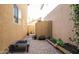Private backyard featuring a fire pit, paver patio, garden bed, and privacy walls at 1950 W Park Pl, Chandler, AZ 85224