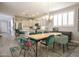 Bright dining area with modern light fixture, large windows, and stylish furniture at 1950 W Park Pl, Chandler, AZ 85224