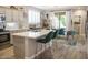 Bright kitchen with a large island, modern appliances, and a seamless connection to the outdoor dining area at 1950 W Park Pl, Chandler, AZ 85224