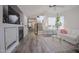 Comfortable living room featuring tile floors, high ceilings, and a cozy fireplace at 1950 W Park Pl, Chandler, AZ 85224