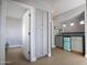 This room features storage cabinets, mini refrigerator, and neutral walls at 1950 W Park Pl, Chandler, AZ 85224