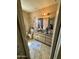 Cozy bathroom with a single sink vanity, neutral decor, and standard fixtures and toilet at 201 S Greenfield Rd # 23, Mesa, AZ 85206