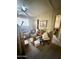 Bedroom with ceiling fan, closet, window, and lots of clutter at 201 S Greenfield Rd # 23, Mesa, AZ 85206
