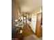 Functional kitchen featuring ample countertop space, white appliances, and a convenient laundry area at 201 S Greenfield Rd # 23, Mesa, AZ 85206