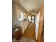 Functional kitchen featuring ample countertop space, white appliances, and a convenient laundry area at 201 S Greenfield Rd # 23, Mesa, AZ 85206