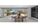 Elegant dining space with outdoor views, modern wine rack, and a seamless indoor-outdoor flow at 20274 N 76Th Way, Scottsdale, AZ 85255