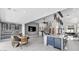 Spacious open-concept living area with a modern kitchen, dining table, and staircase, perfect for gatherings at 20274 N 76Th Way, Scottsdale, AZ 85255