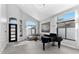 Well-lit living room boasting tall windows, comfortable seating, and grand piano at 20274 N 76Th Way, Scottsdale, AZ 85255