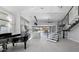 Bright and spacious living room with modern staircase, piano, and kitchen view at 20274 N 76Th Way, Scottsdale, AZ 85255