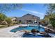 Inviting backyard with a stunning rock-lined pool and spa, perfect for outdoor relaxation and entertaining at 20274 N 76Th Way, Scottsdale, AZ 85255