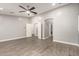 Large Primary bedroom with neutral tones, ample closet space, and en-suite bathroom access at 20427 N 88Th Dr, Peoria, AZ 85382