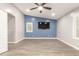 Modern bedroom with a blue accent wall, plantation shutters, and a ceiling fan at 20427 N 88Th Dr, Peoria, AZ 85382