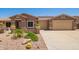 Charming single-story home with desert landscaping and a three car garage at 20427 N 88Th Dr, Peoria, AZ 85382