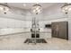 Close-up of a kitchen featuring granite countertops, a stainless steel sink, and pendant lighting at 20427 N 88Th Dr, Peoria, AZ 85382