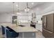 Modern kitchen features granite countertops, a stainless steel sink, and updated appliances at 20427 N 88Th Dr, Peoria, AZ 85382