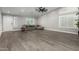 Inviting living room with abundant natural light and stylish wood-look flooring at 20427 N 88Th Dr, Peoria, AZ 85382