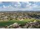 Scenic aerial view of the community, highlighting the golf course, desert landscape, and distant mountains at 20802 N Grayhawk Dr # 1123, Scottsdale, AZ 85255