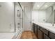 Bathroom featuring double vanity, shower, and tub at 20802 N Grayhawk Dr # 1123, Scottsdale, AZ 85255