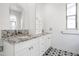 Bright bathroom featuring granite counters, white cabinets, and decorative tile flooring at 20802 N Grayhawk Dr # 1123, Scottsdale, AZ 85255