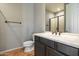 Neutral toned bathroom features a tiled floor, white sink, and walk in shower at 20802 N Grayhawk Dr # 1123, Scottsdale, AZ 85255